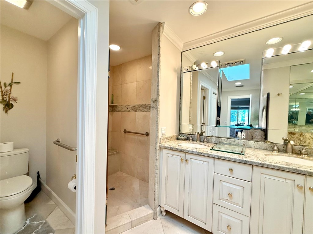 869 Robin Lane Sebastian, FL 32958 - Photo 15 of 35 a bathroom with a double vanity sink toilet and shower