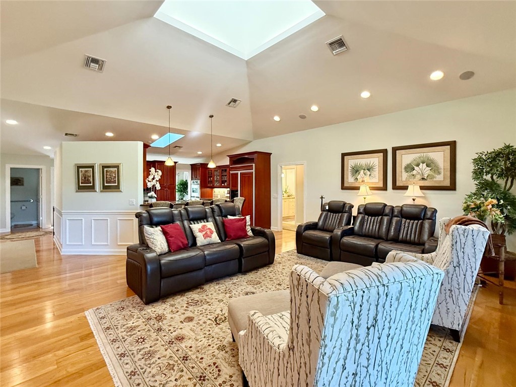 869 Robin Lane Sebastian, FL 32958 - Photo 24 of 35 a living room with furniture and wooden floor