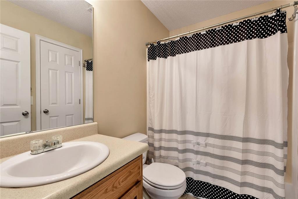 1044 Lothridge Road Cleveland, GA 30528 - Photo 30 of 40 a bathroom with a sink a toilet and a mirror