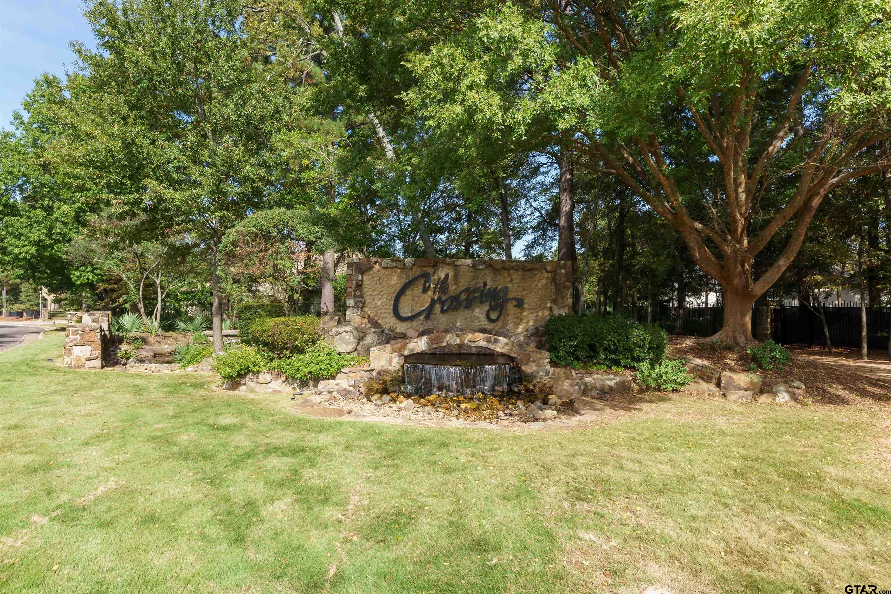 7535 Cross Gate Way Tyler, TX 75703 - Photo 9 of 17 a backyard of a house with fountain table and chairs