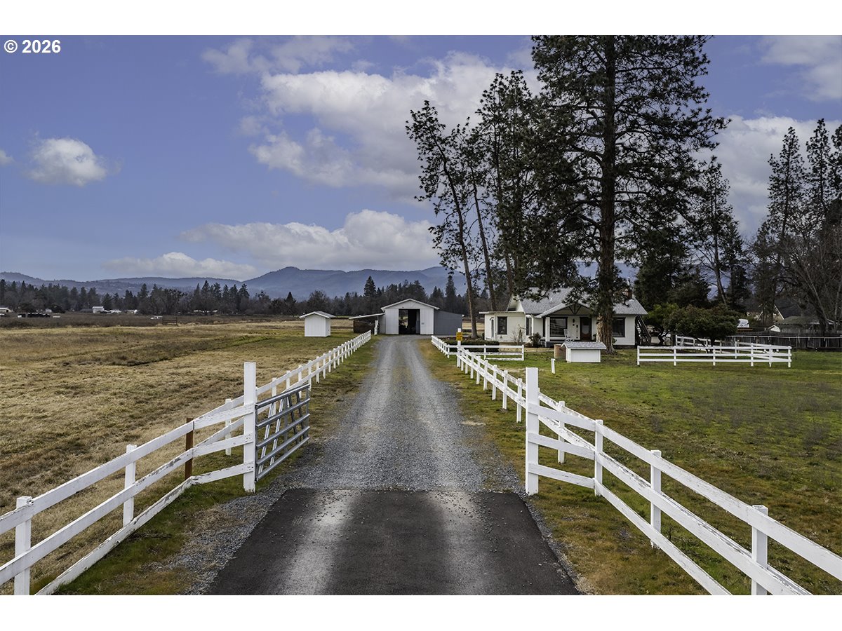 408 Oak Grove Road Medford, OR 97501 - Photo 1 of 46 a view of a city with swimming pool and mountains