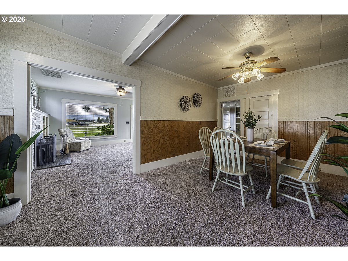 408 Oak Grove Road Medford, OR 97501 - Photo 13 of 46 a dining room with furniture and a chandelier