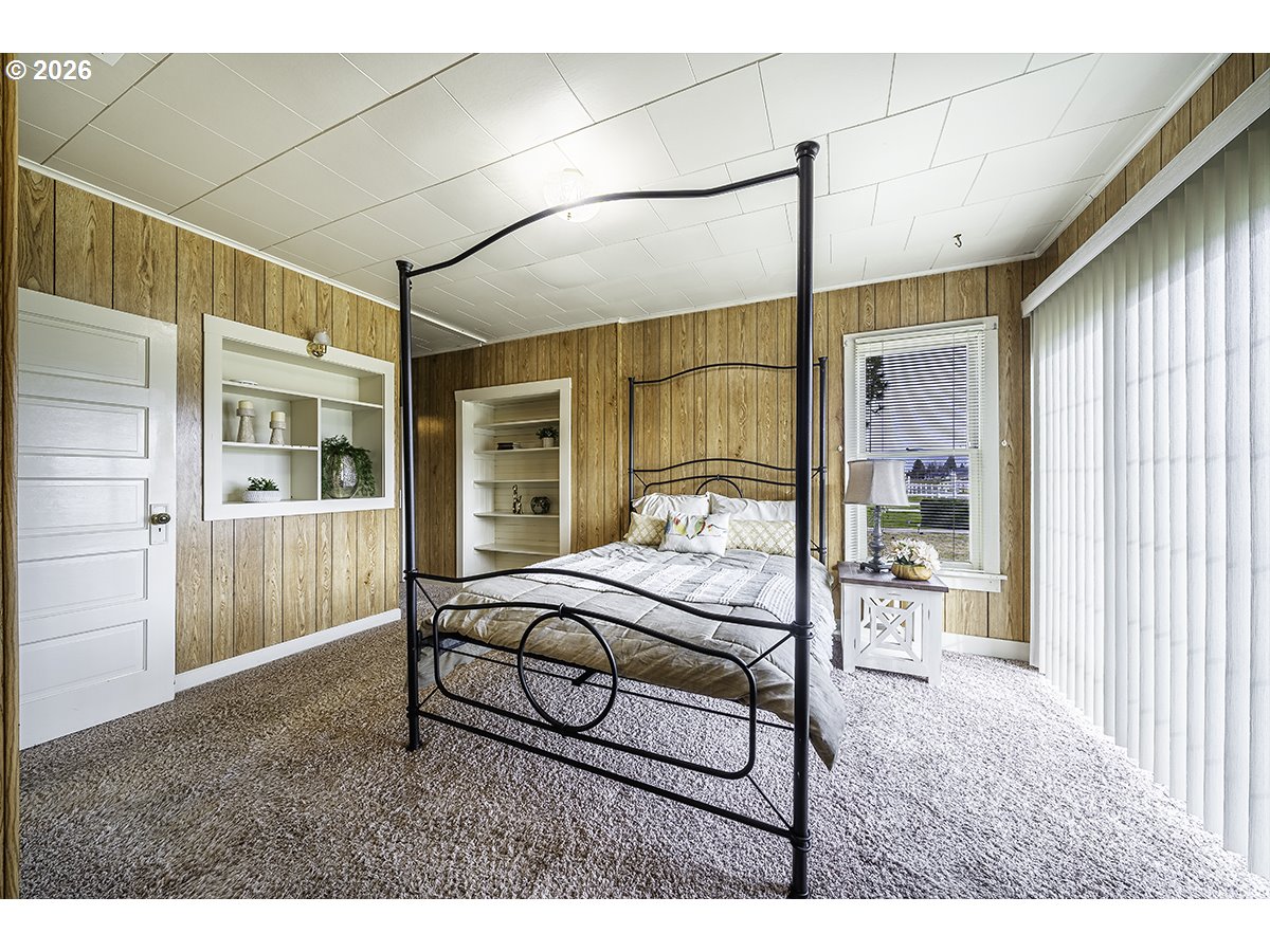 408 Oak Grove Road Medford, OR 97501 - Photo 18 of 46 a bedroom with furniture and a window