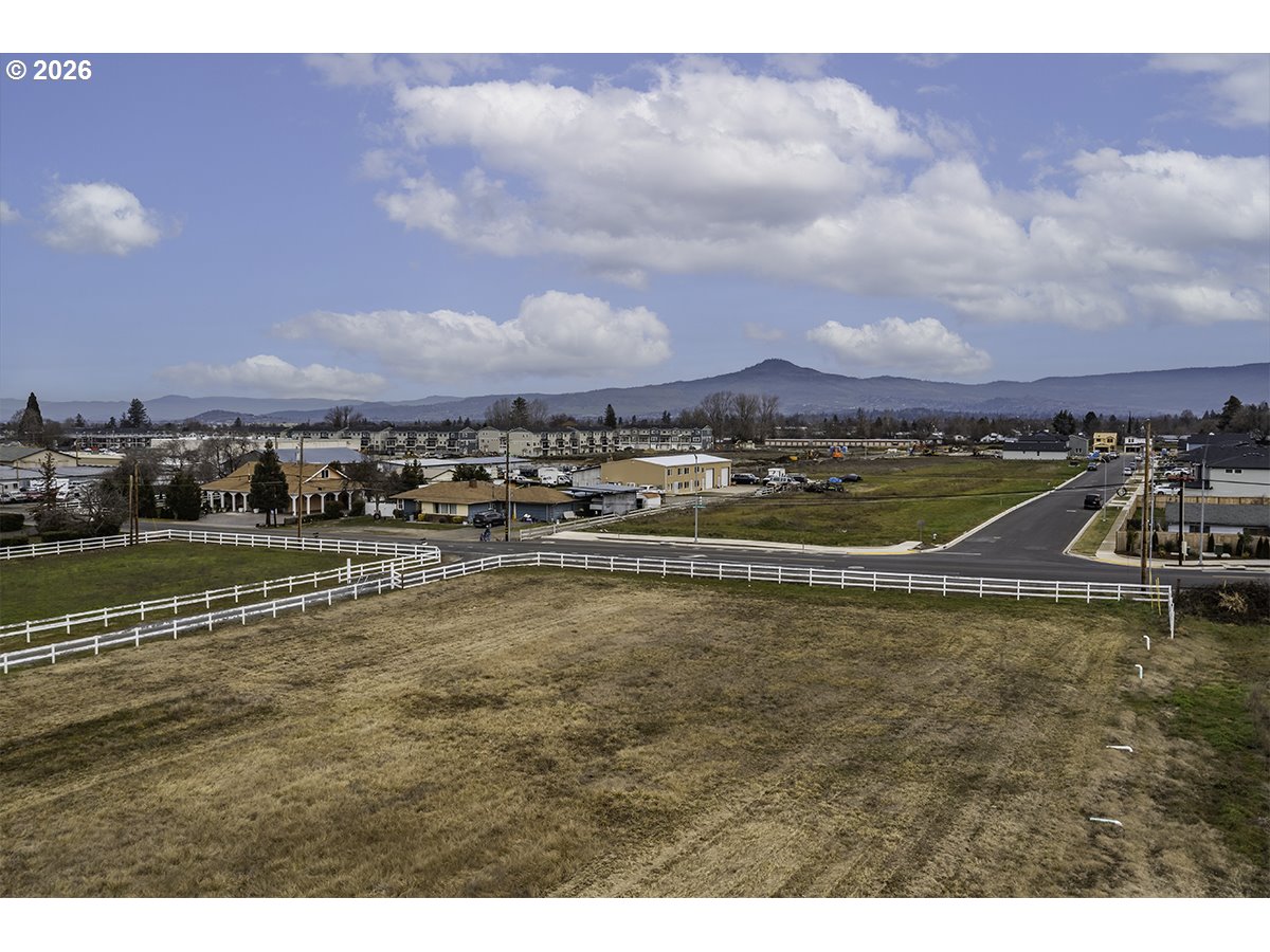408 Oak Grove Road Medford, OR 97501 - Photo 23 of 46 a view of a lake with houses in the back