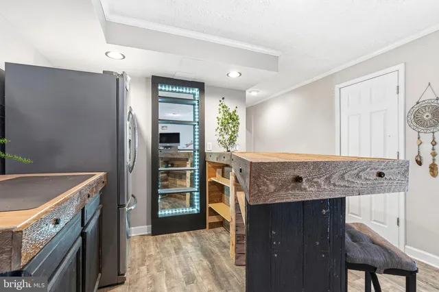 a view of a kitchen cabinets and a wooden floor