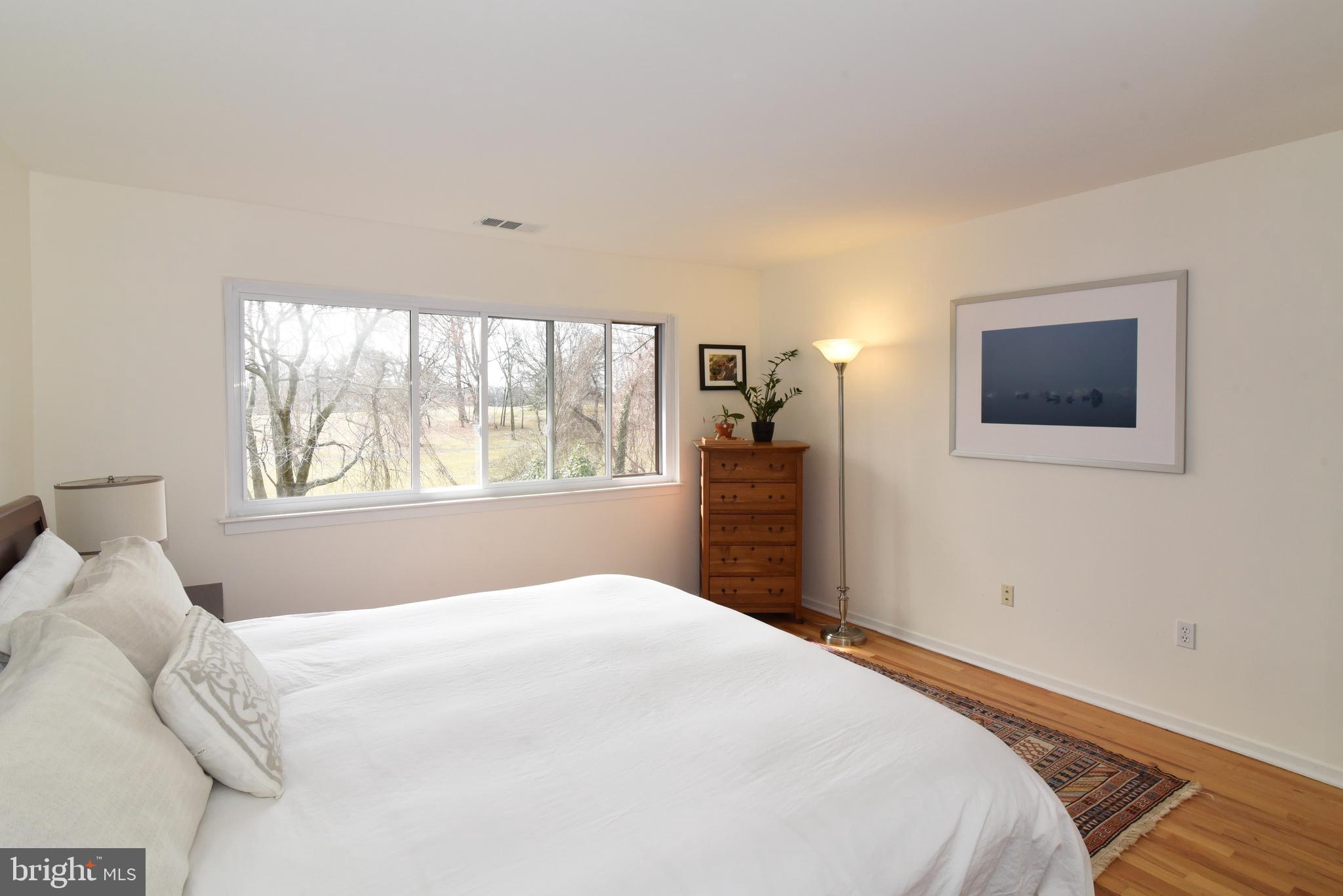 11749 Indian Ridge Road Reston, VA 20191 - Photo 25 of 53 a bedroom with a large bed and a window