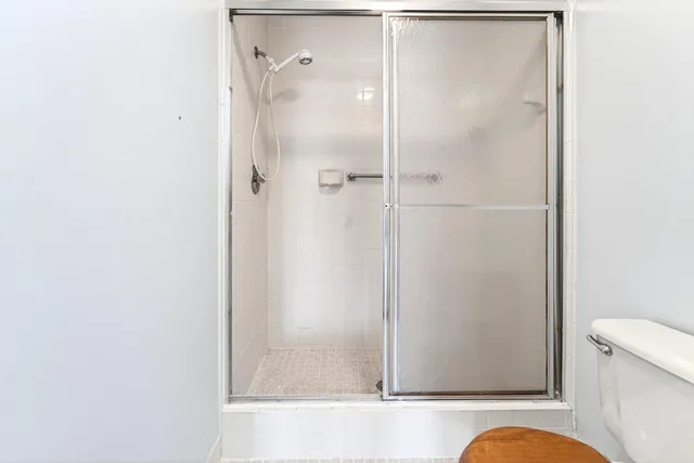 a bathroom with a bathtub and a shower