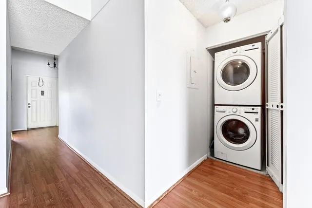 a view of a hallway with washer and dryer