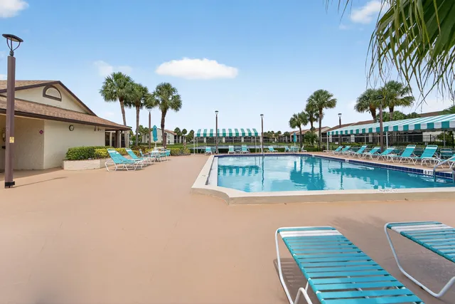 a view of a backyard with table and chairs
