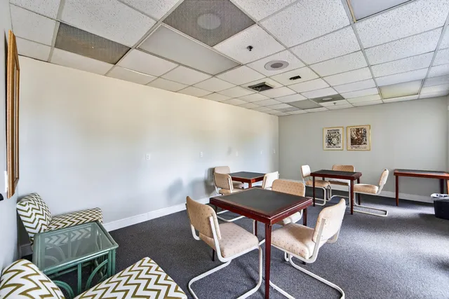 a view of a lake with houses in the back