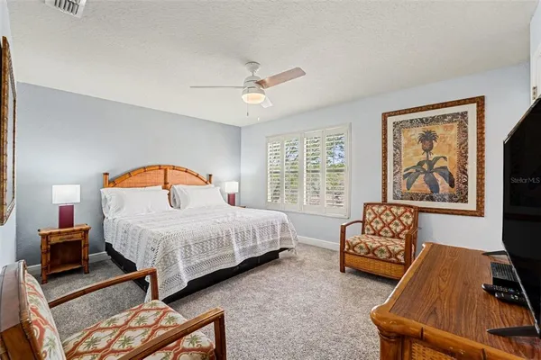 a bedroom with furniture and a window