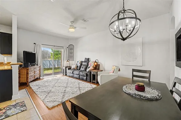 a kitchen with a table and chairs in it