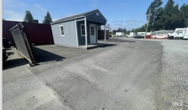 a view of a parking space in front of a house