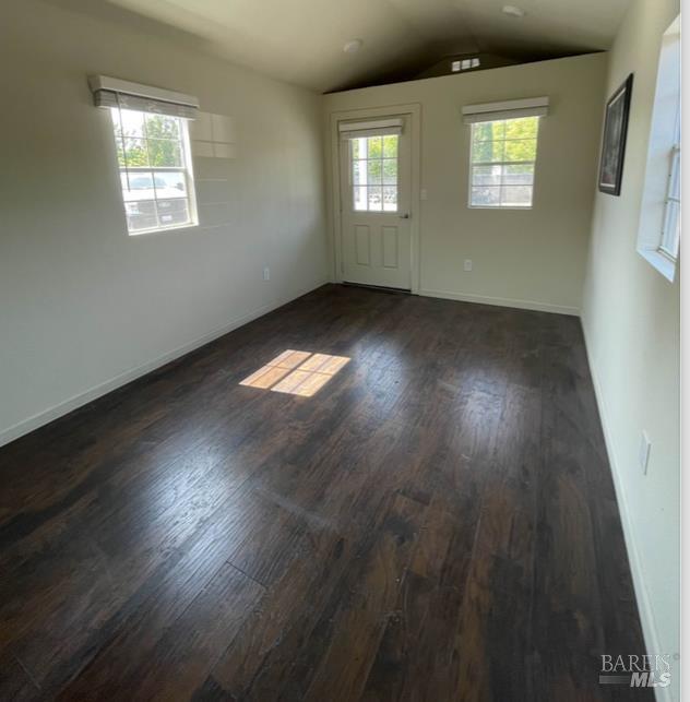 3753 Santa Rosa Avenue, Unit E Santa Rosa, CA 95407 - Photo 7 of 18 an empty room with wooden floor and windows