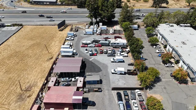 an aerial view of a houses with outdoor space