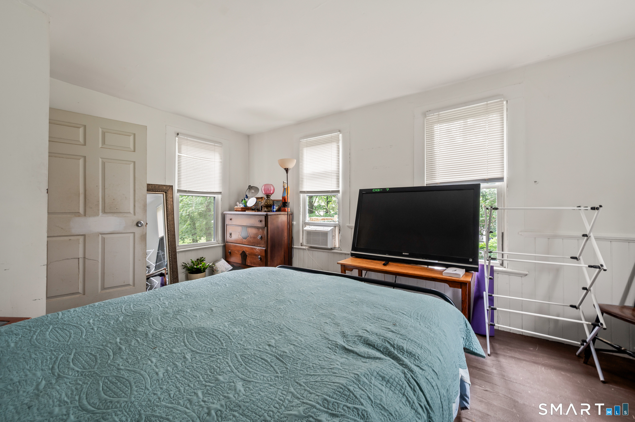 220 Murray Street Meriden, CT 06450 - Photo 21 of 28 a bedroom with a bed and a flat screen tv