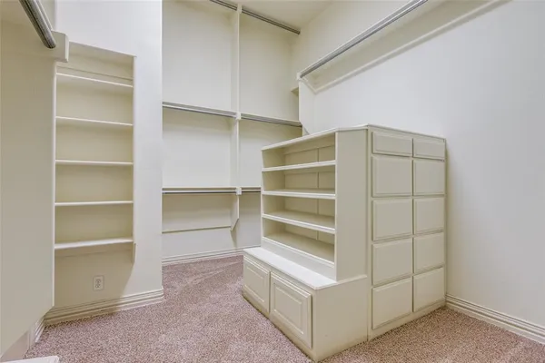 a view of an empty walk in closet