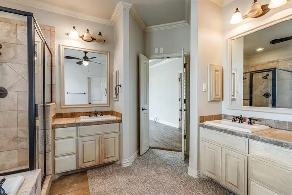 a bathroom with a double vanity sink and mirror