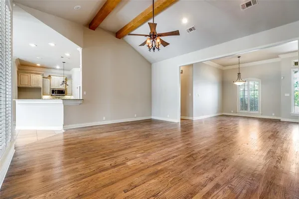 a view of a kitchen with a wooden floor and a kitchen view