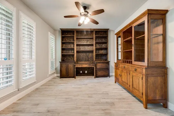 a spacious bathroom with a double vanity sink and a mirror