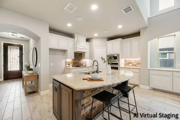 a room with white cabinets and sink