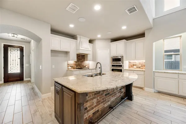 a living room with furniture a couch and decor
