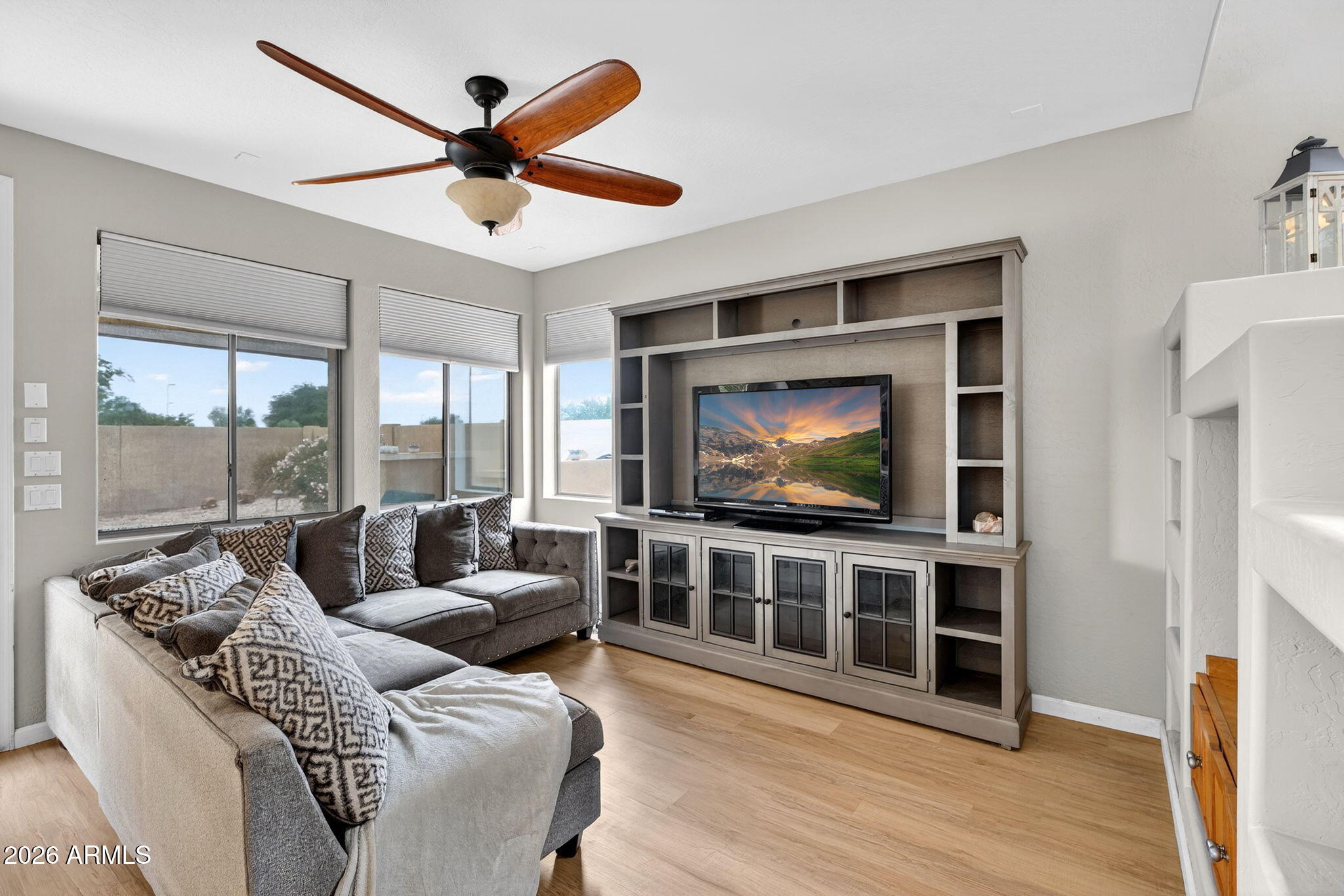 6280 South Sinova Court Gilbert, AZ 85298 - Photo 11 of 64 a living room with furniture and a flat screen tv