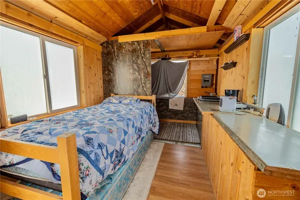 a bedroom with a bed and a walk in closet