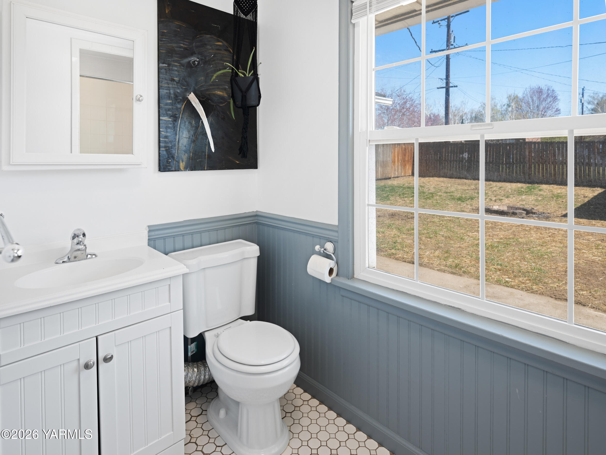 423 South 41st Street Yakima, WA 98901 - Photo 18 of 29 a bathroom with a toilet a sink a window and shower