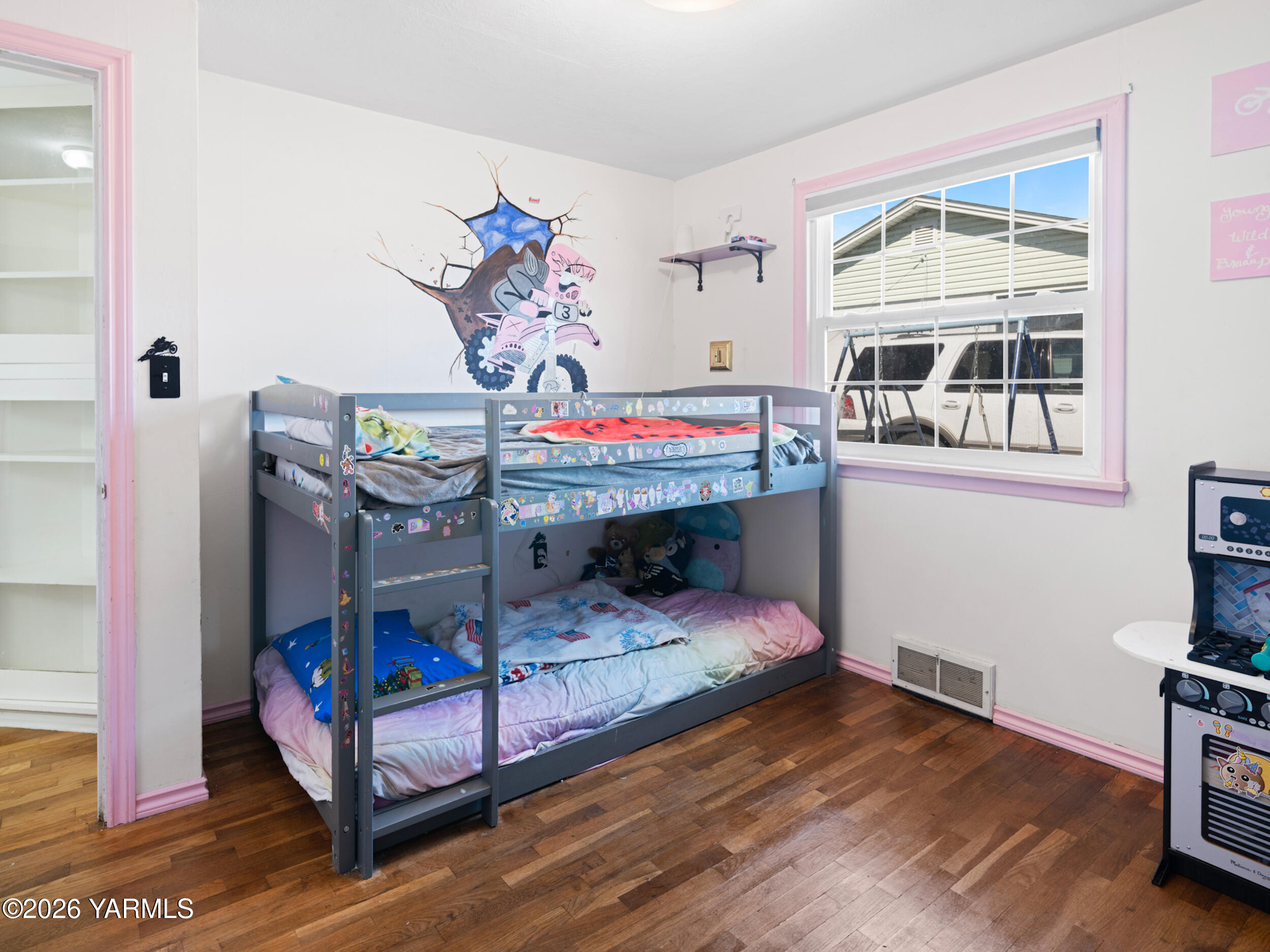 423 South 41st Street Yakima, WA 98901 - Photo 24 of 29 a bedroom with a bed and wooden floor