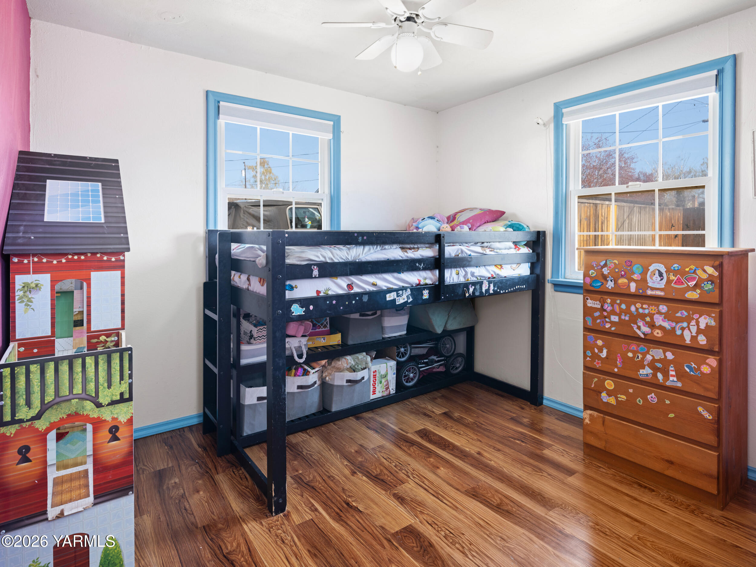 423 South 41st Street Yakima, WA 98901 - Photo 25 of 29 a room with lots of books and a baby crib