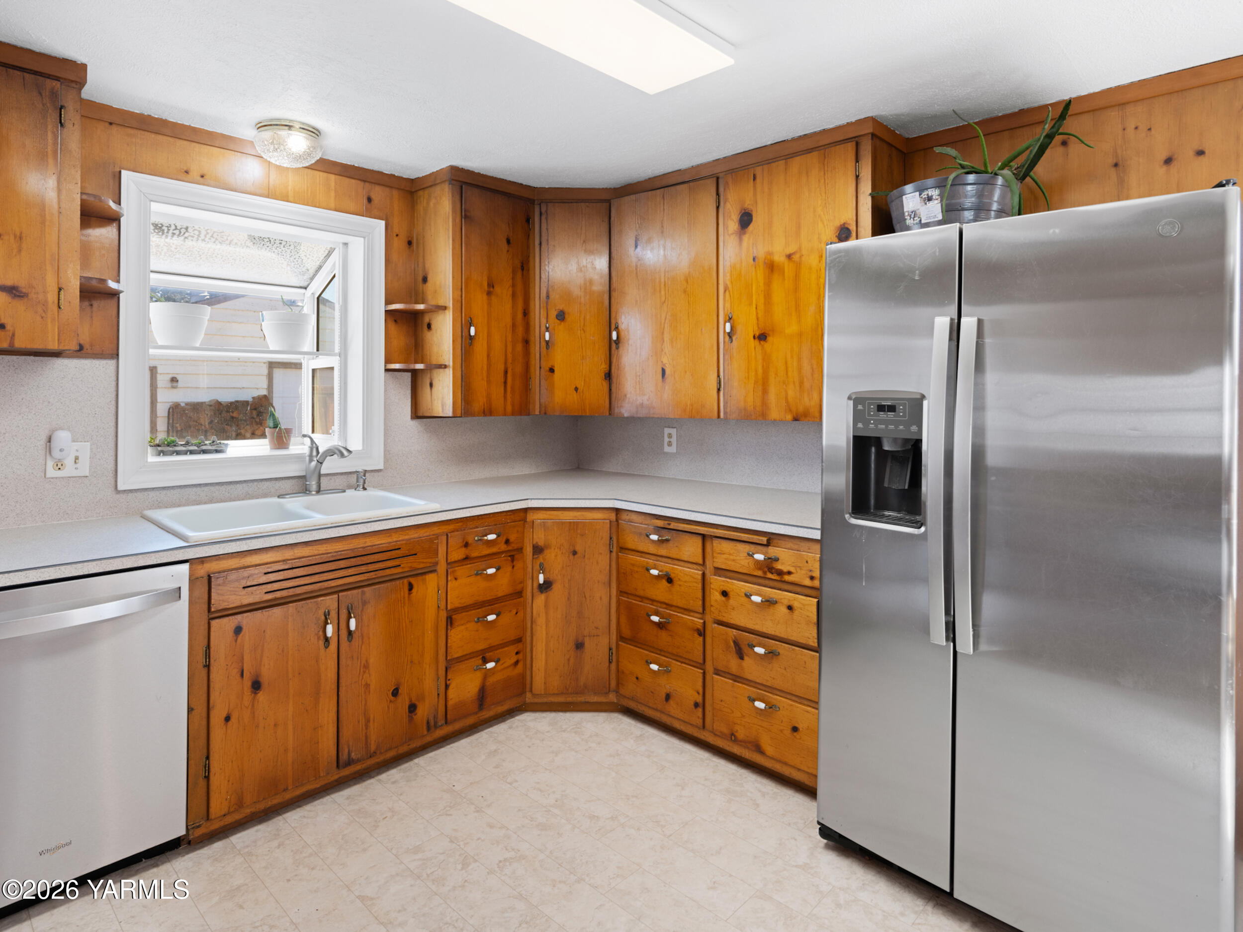 423 South 41st Street Yakima, WA 98901 - Photo 4 of 29 a kitchen with stainless steel appliances granite countertop a refrigerator and a sink