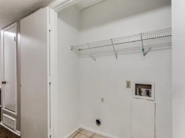 a view of a room with racks on the wall