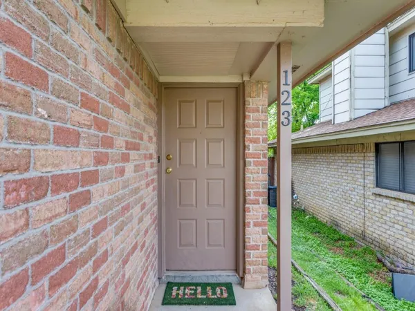 a view of a wooden door of the house