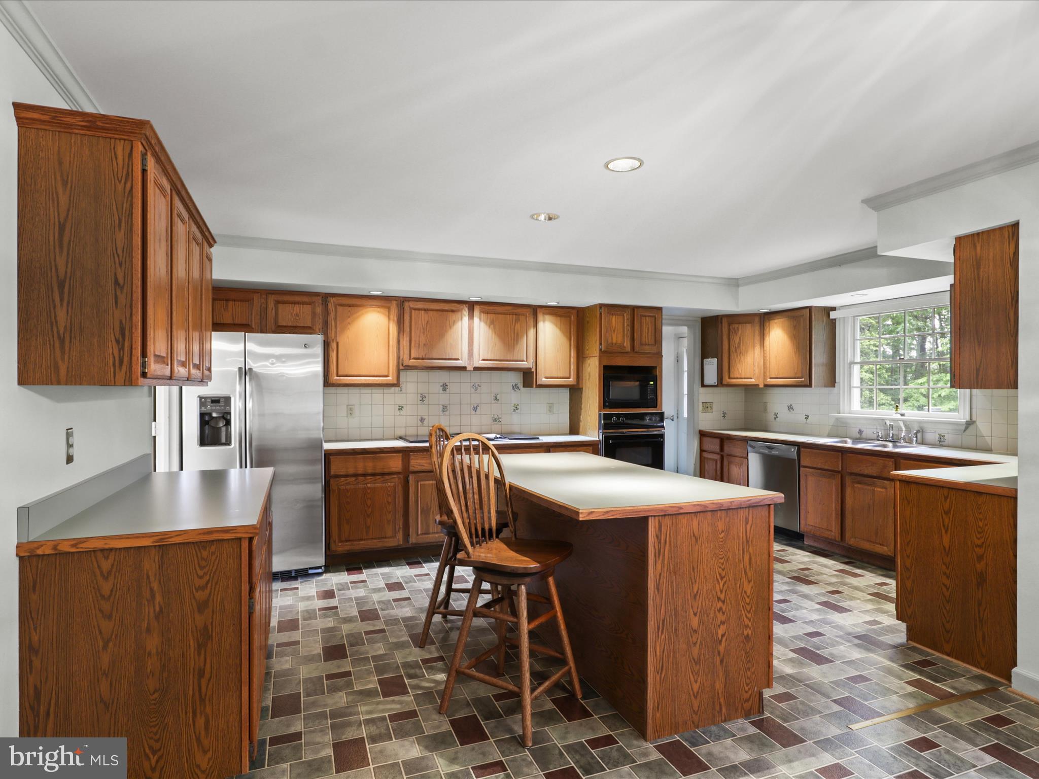 13124 South River Road Sumerduck, VA 22742 - Photo 12 of 54 a kitchen with granite countertop a sink a counter top space and stainless steel appliances
