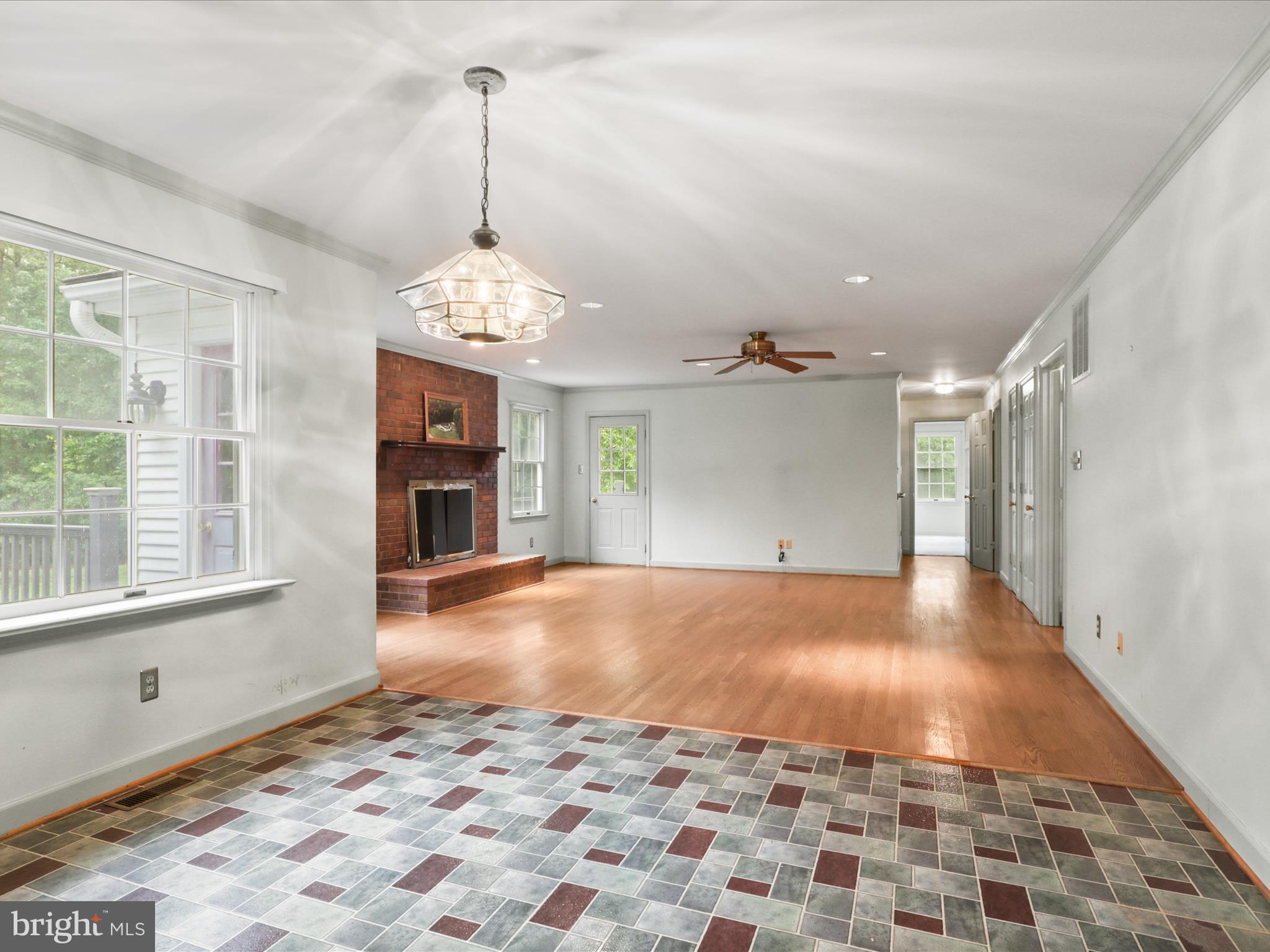13124 South River Road Sumerduck, VA 22742 - Photo 16 of 54 a big room with chandelier and windows