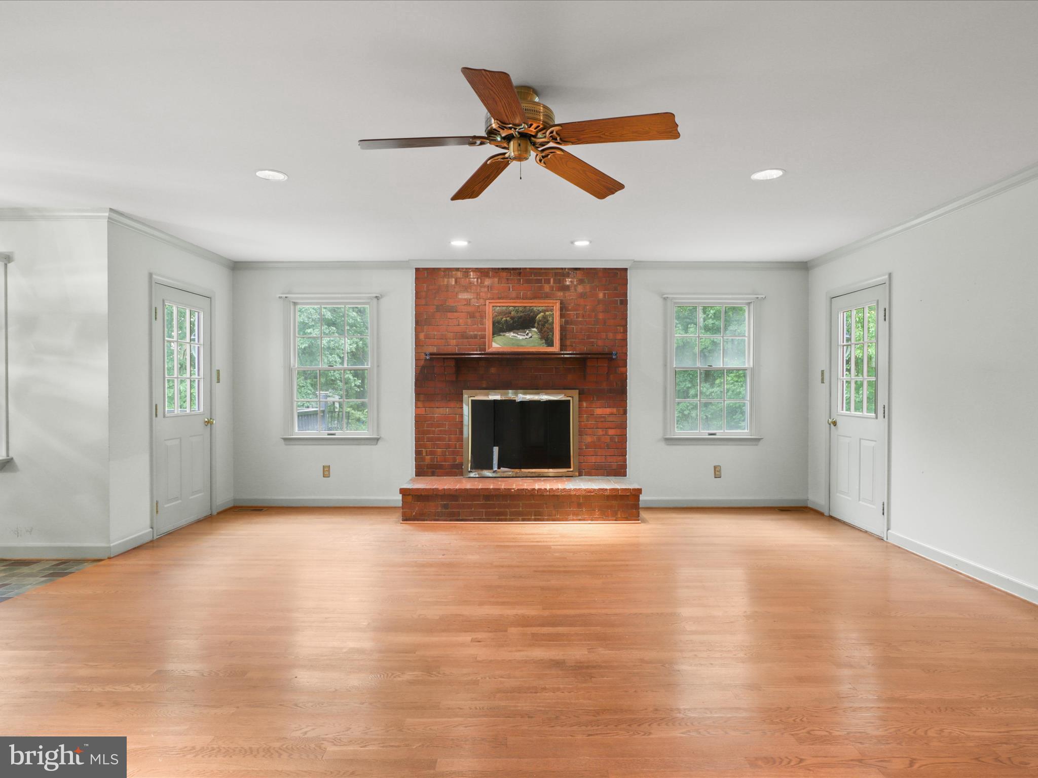 13124 South River Road Sumerduck, VA 22742 - Photo 17 of 54 a view of an empty room with a window and a fireplace