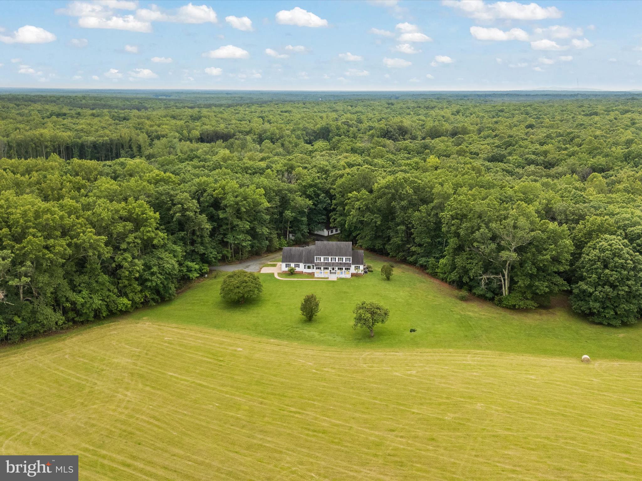 13124 South River Road Sumerduck, VA 22742 - Photo 2 of 54 a view of a swimming pool with an outdoor space and seating area