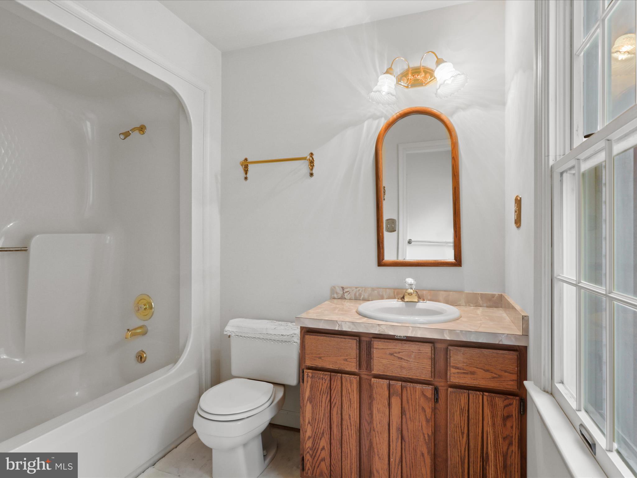 13124 South River Road Sumerduck, VA 22742 - Photo 24 of 54 a bathroom with a granite countertop toilet a sink and a bathtub