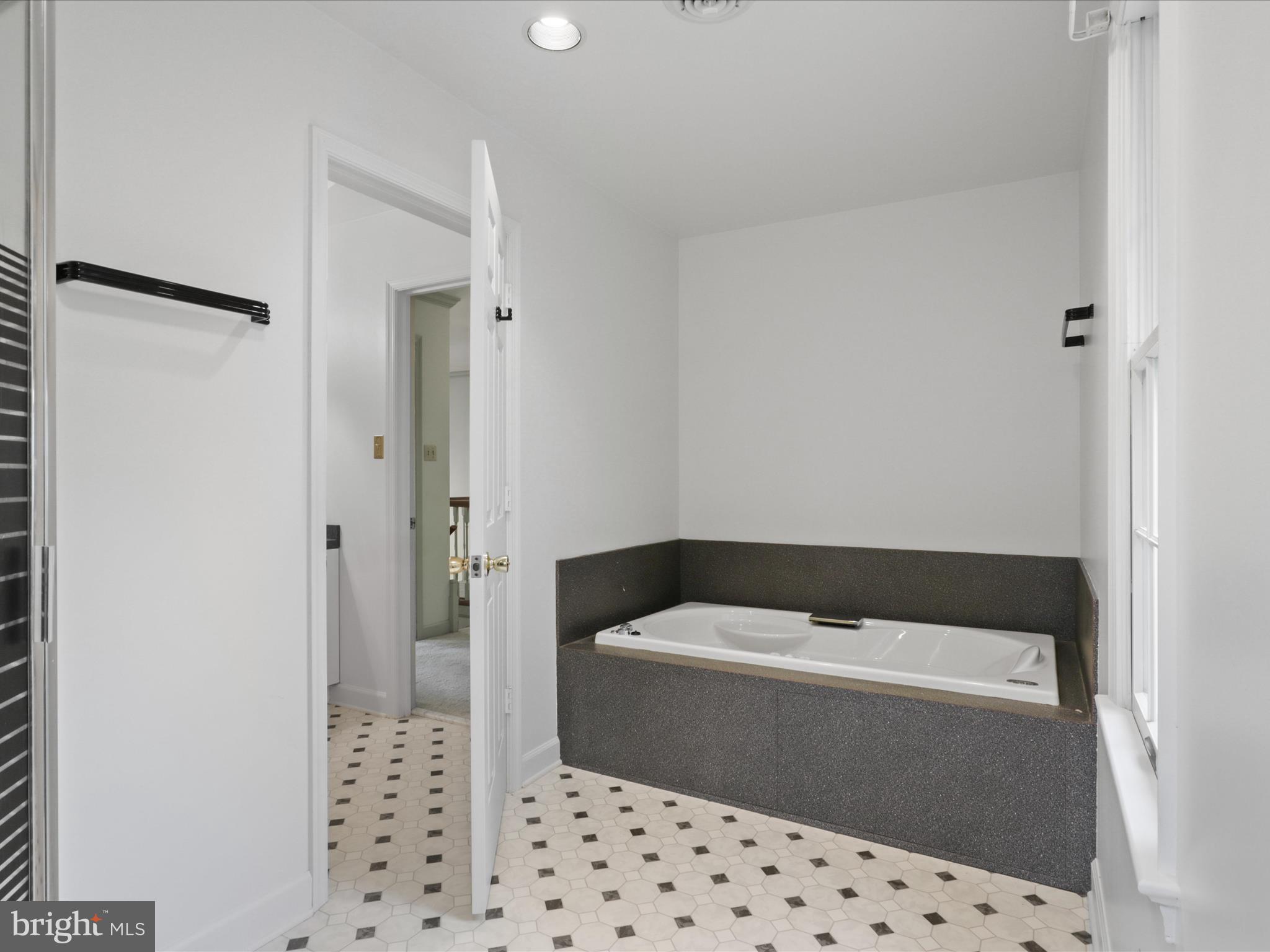 13124 South River Road Sumerduck, VA 22742 - Photo 34 of 54 a bathroom with a bathtub and shower