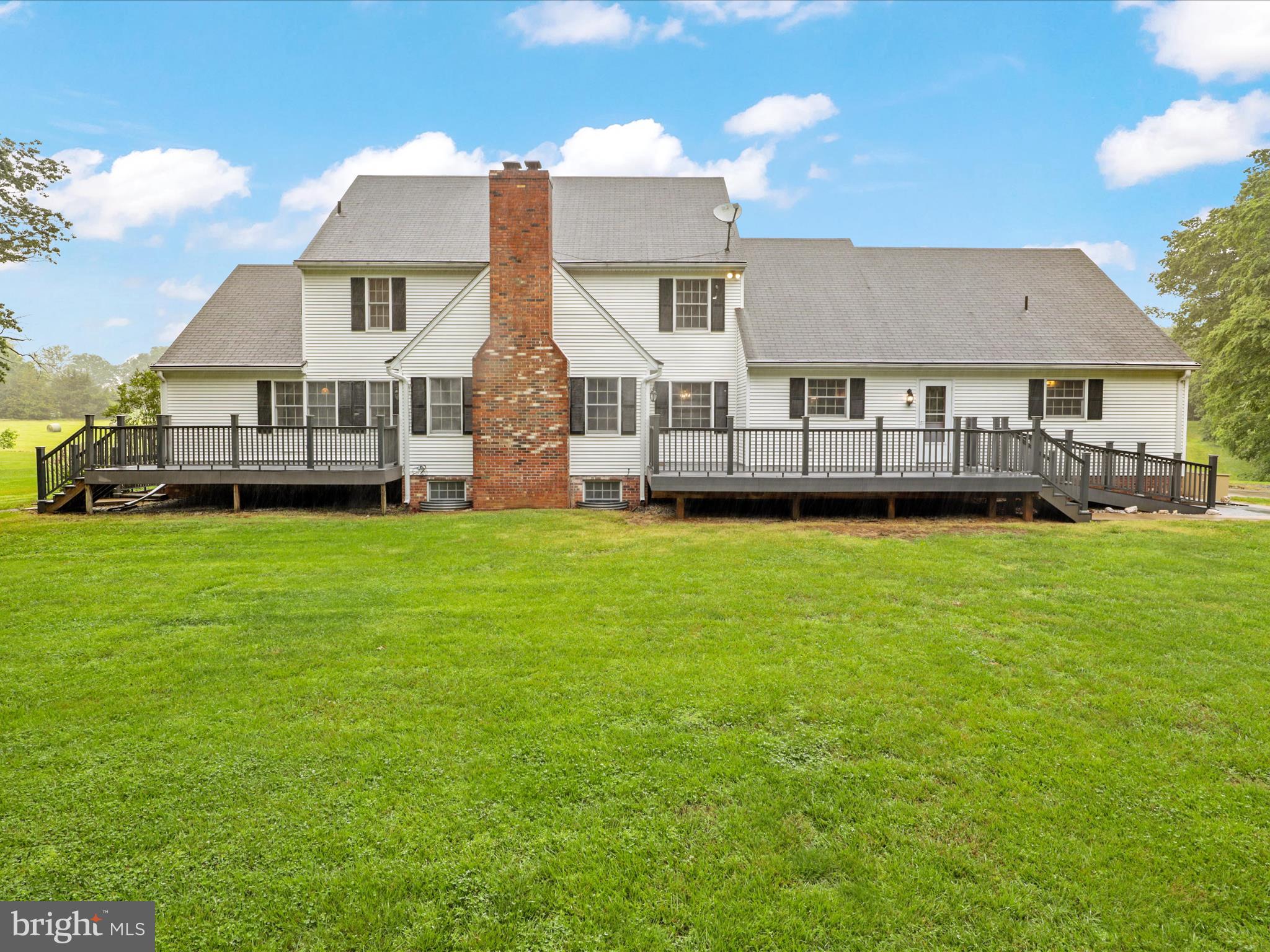 13124 South River Road Sumerduck, VA 22742 - Photo 41 of 54 a front view of a house with a yard and trees