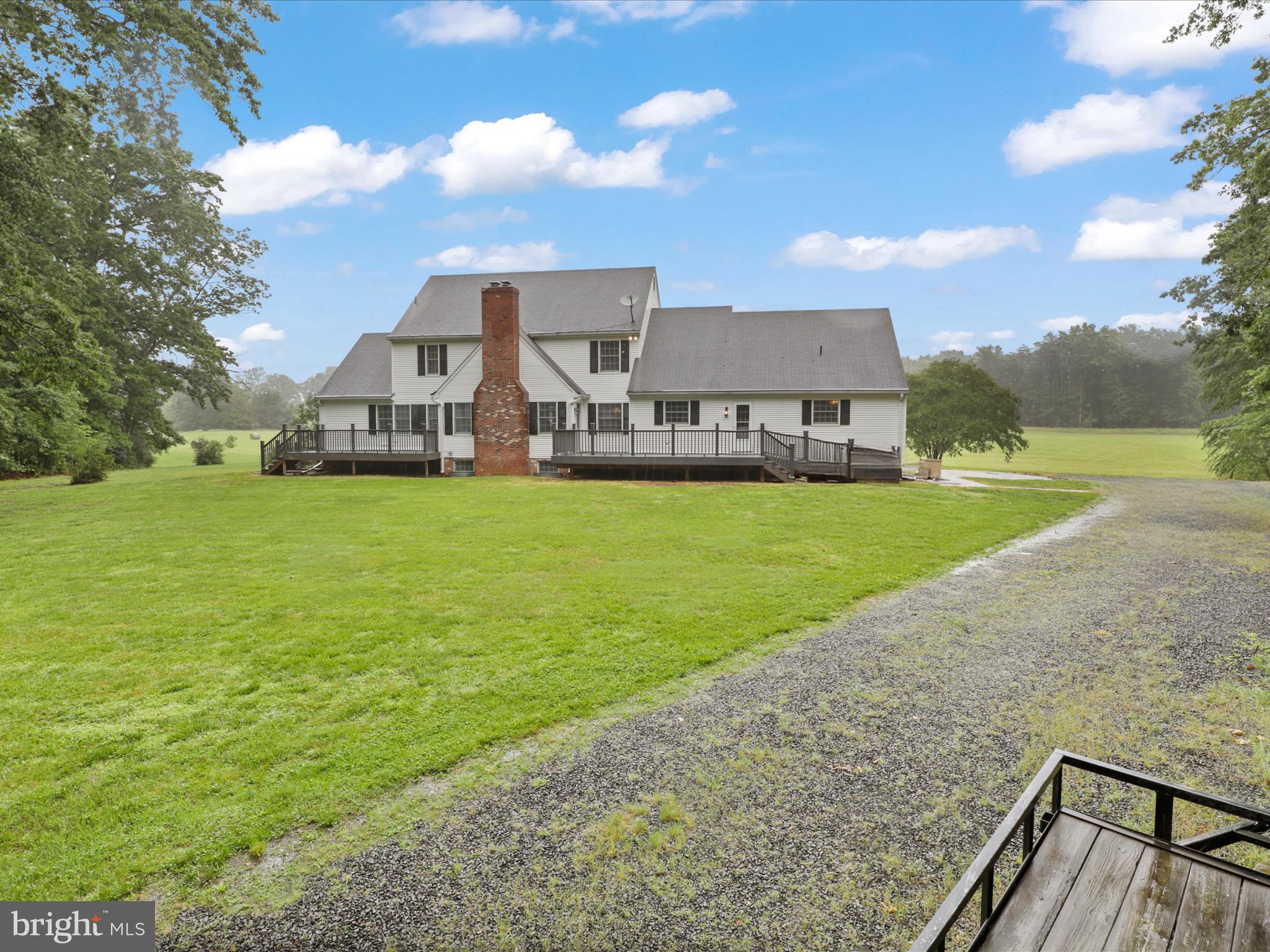 13124 South River Road Sumerduck, VA 22742 - Photo 42 of 54 a view of a house with a yard and a sitting area