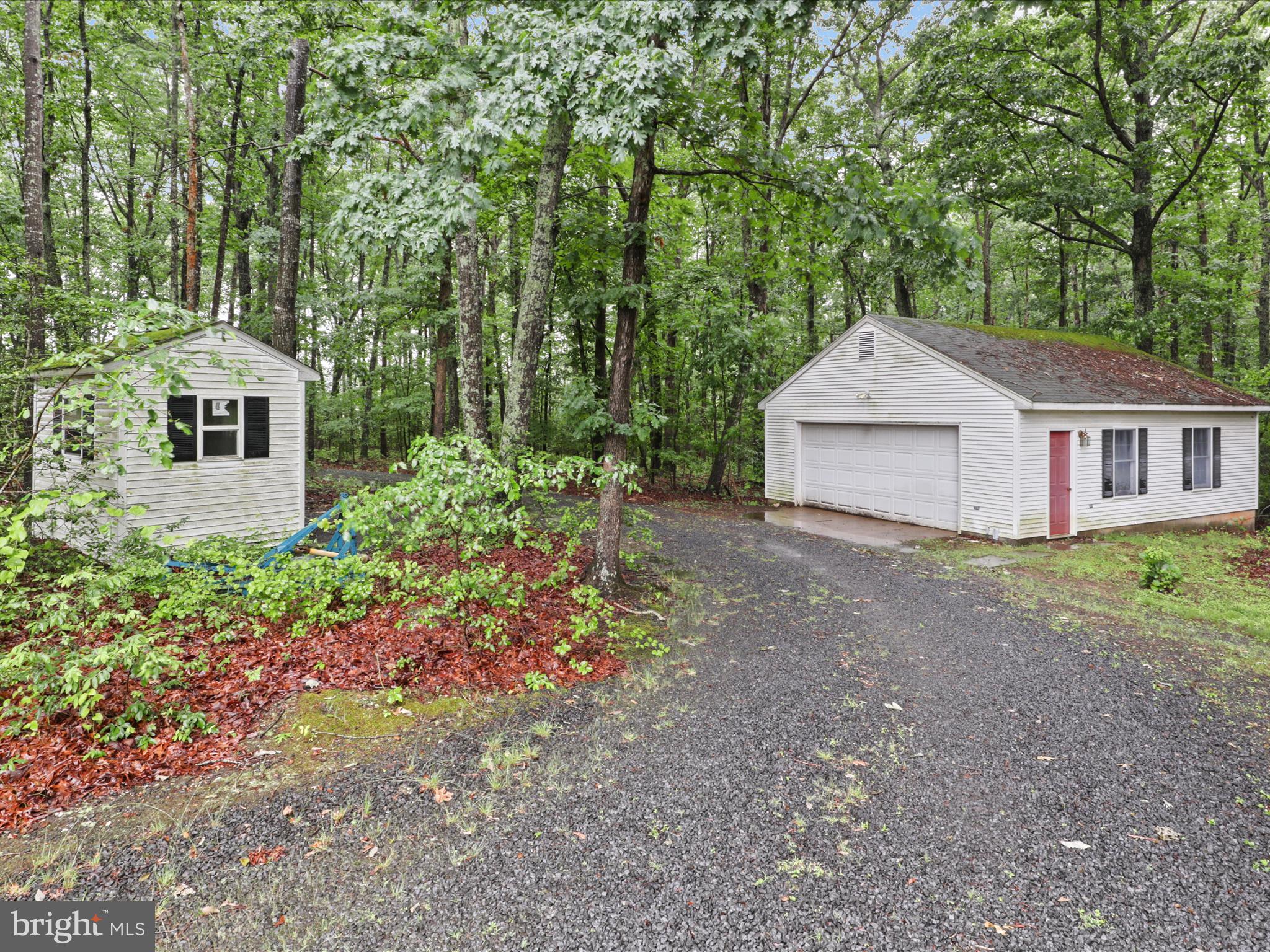 13124 South River Road Sumerduck, VA 22742 - Photo 43 of 54 a front view of a house with a yard and trees