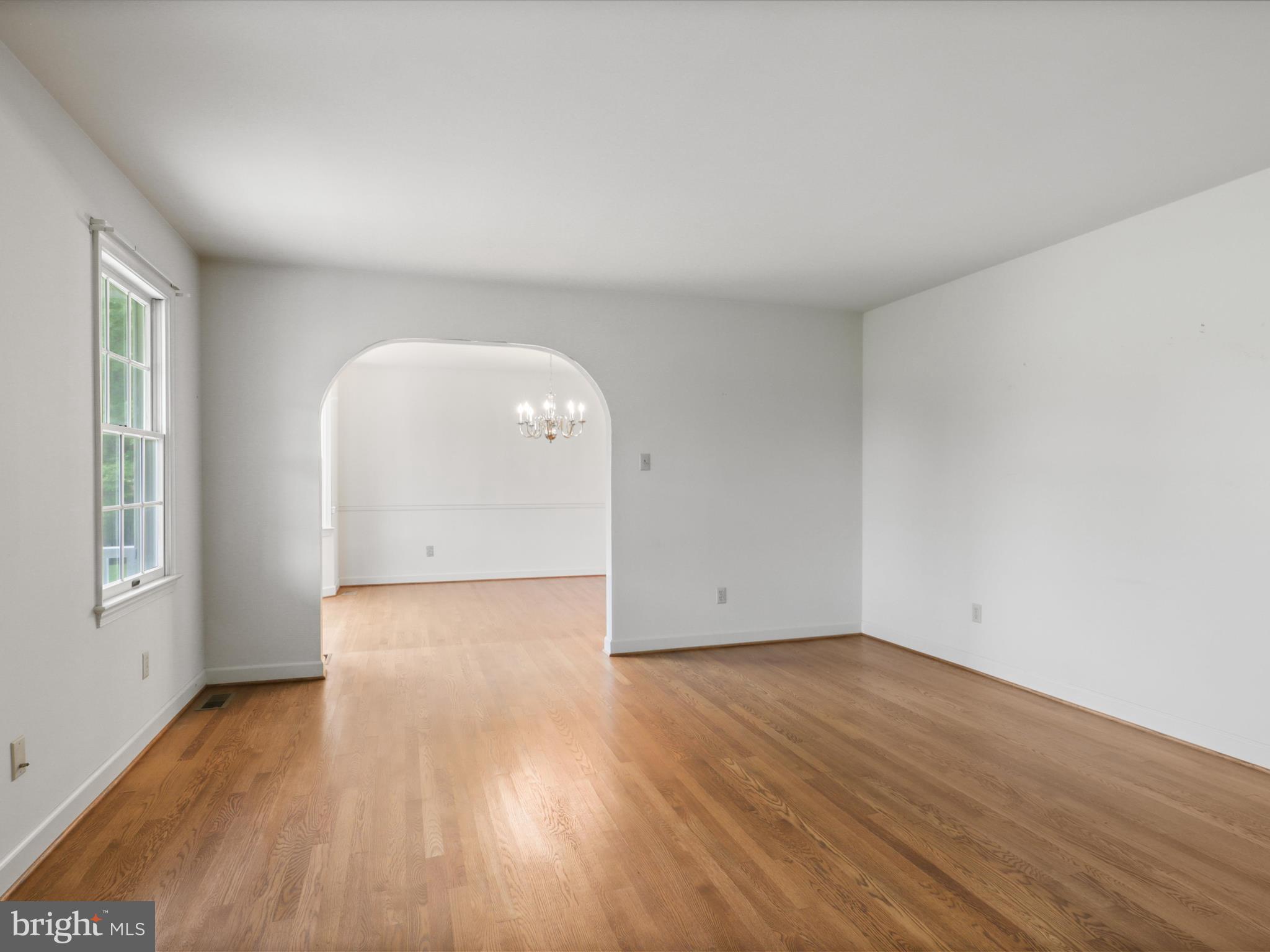 13124 South River Road Sumerduck, VA 22742 - Photo 8 of 54 an empty room with wooden floor and windows