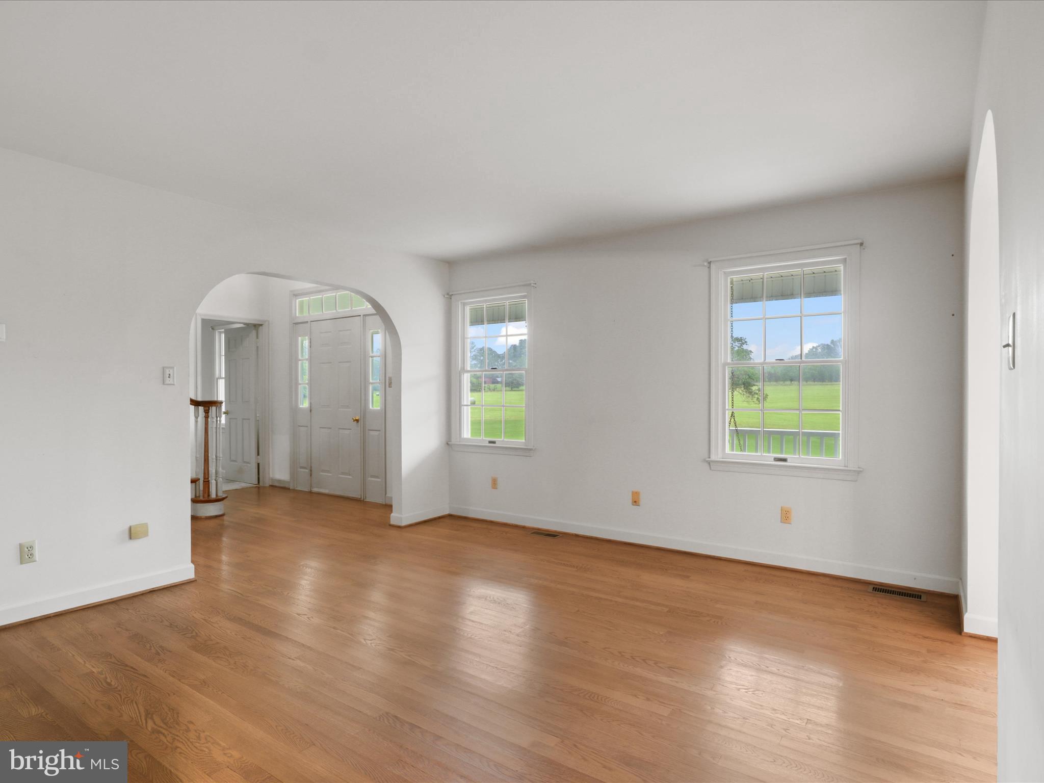 13124 South River Road Sumerduck, VA 22742 - Photo 9 of 54 an empty room with wooden floor and windows