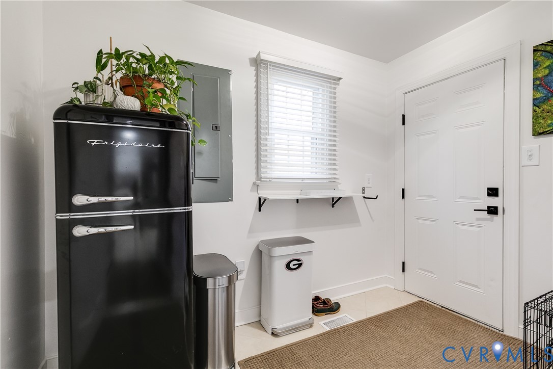 3150 East Brigstock Road Midlothian, VA 23113 - Photo 23 of 50 a kitchen with a refrigerator and trees