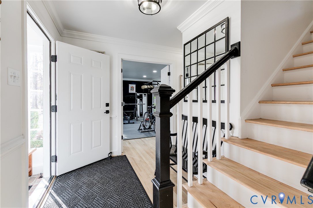 3150 East Brigstock Road Midlothian, VA 23113 - Photo 25 of 50 a view of entryway with wooden floor and stairs