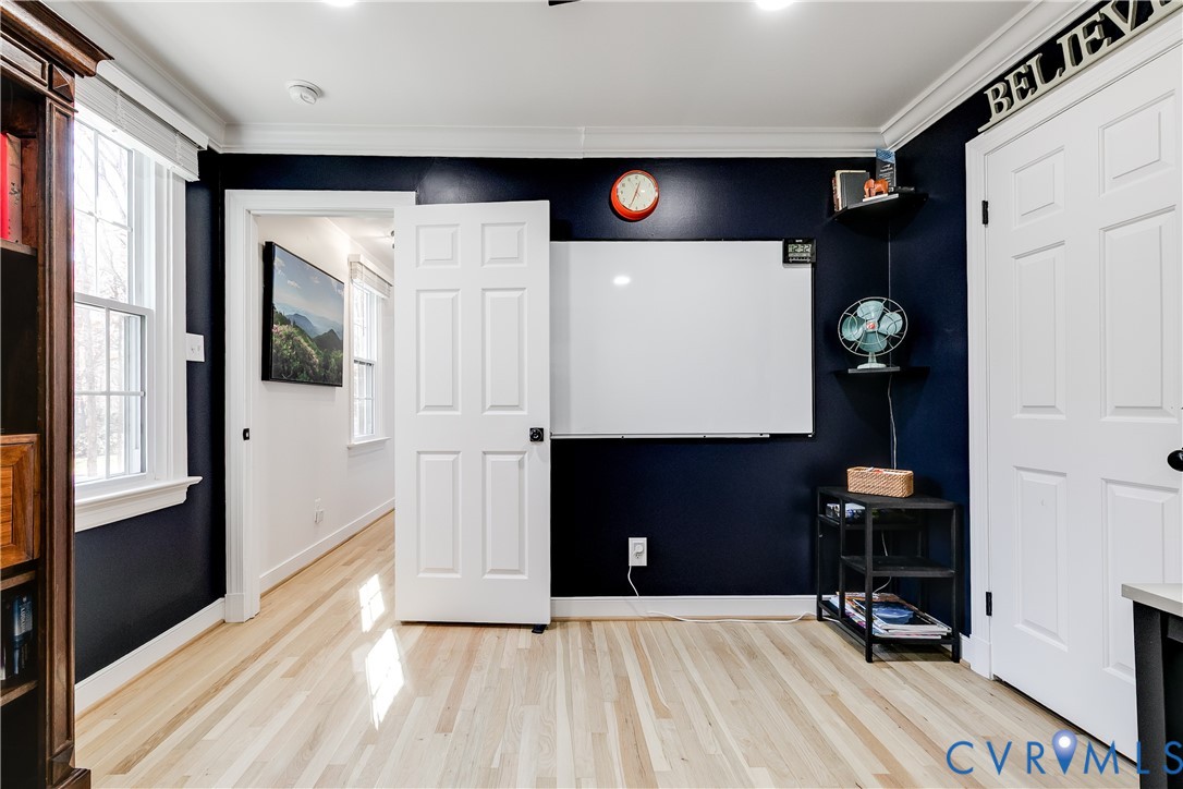 3150 East Brigstock Road Midlothian, VA 23113 - Photo 41 of 50 a view of a hallway with workspace and a window
