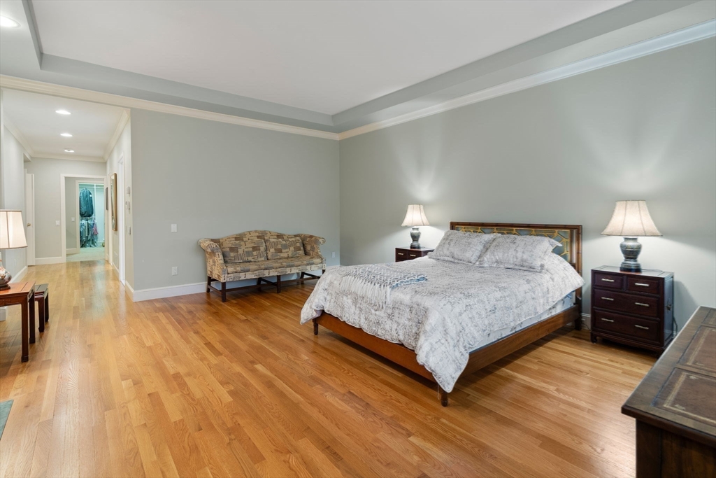 214 Allandale Road, Unit D Boston, MA 02467 - Photo 20 of 40 a bedroom with a bed and window