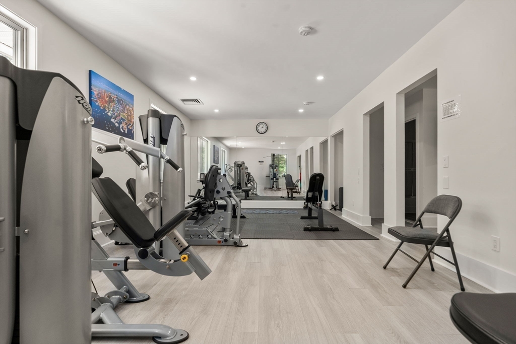 214 Allandale Road, Unit D Boston, MA 02467 - Photo 38 of 40 a view of a room with gym equipment